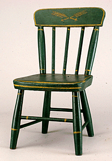 A simple painted child's chair.