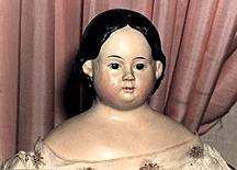 Antique doll with porcelain face.