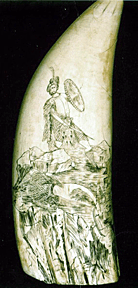 A whale's tooth with a scrimshaw design.